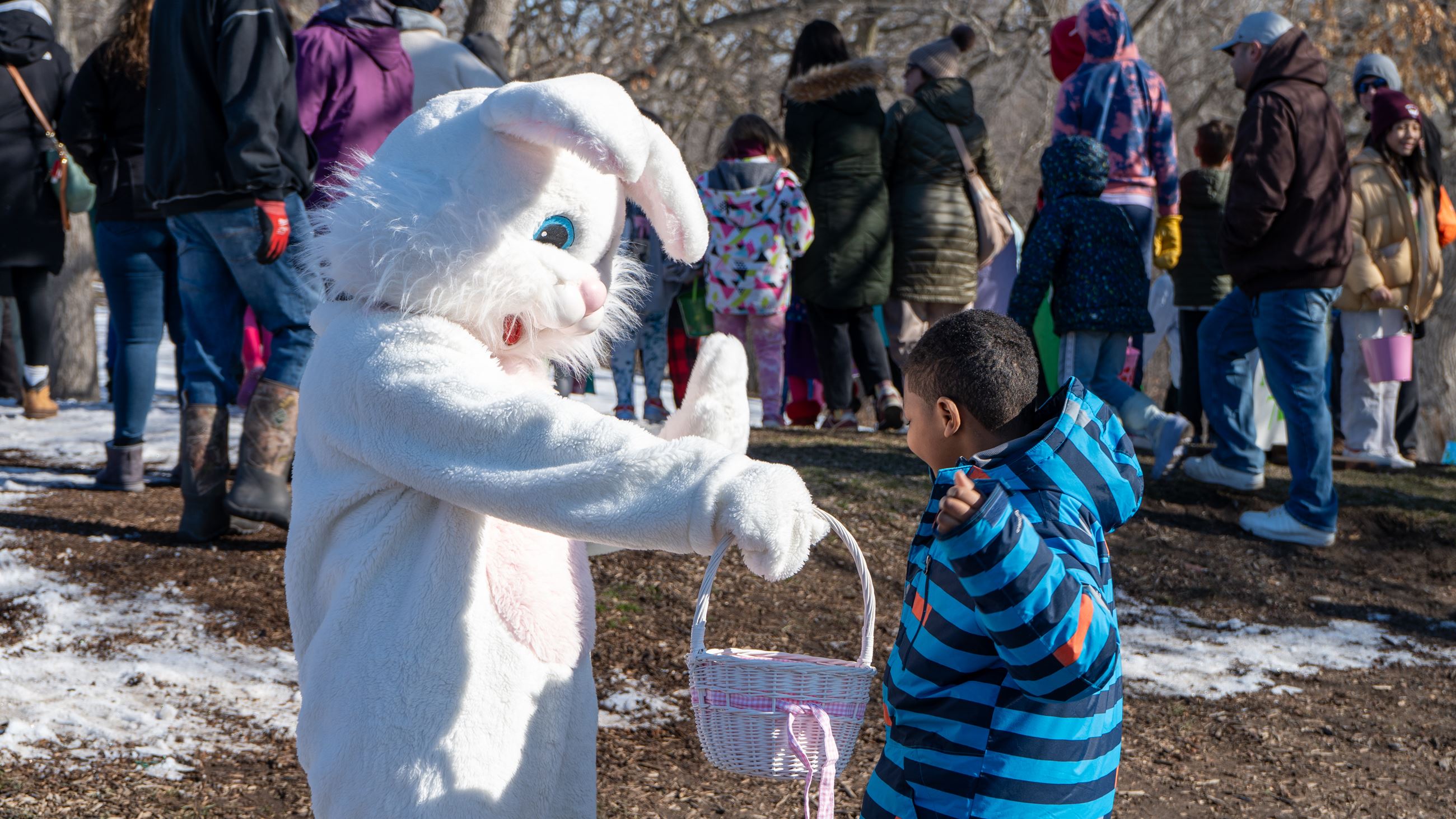 Excited child interacting with the Easter Bunny