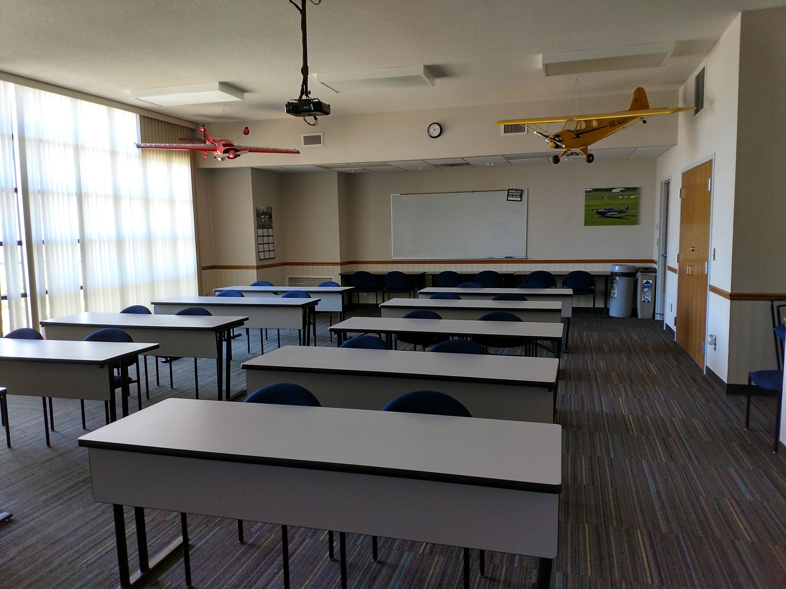 Viewing the front of the classroom, showing the podium and the screen